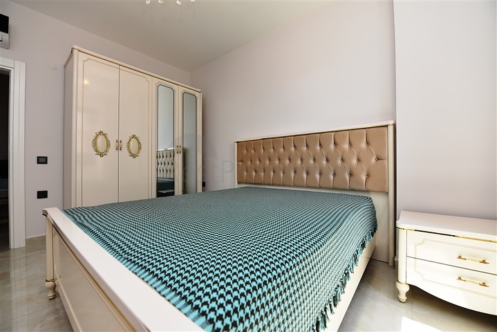 شقة بتصميم غرفتين وصالة  - ضمن مجمع حديث في مهموتلار 