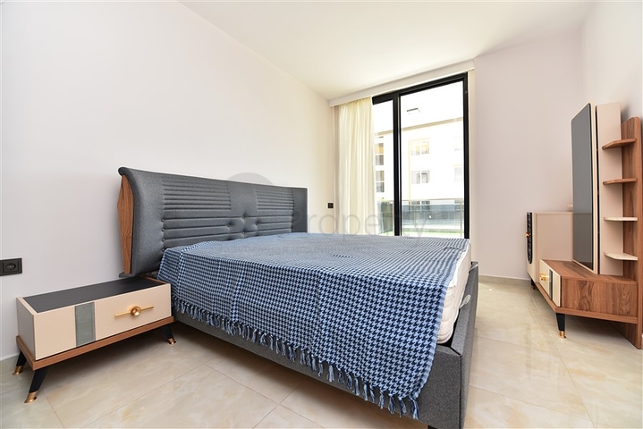 شقة بتصميم غرفتين وصالة  - ضمن مجمع حديث في مهموتلار 