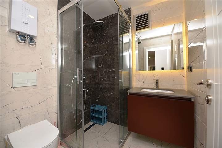 شقة بتصميم غرفتين وصالة  - ضمن مجمع حديث في مهموتلار 