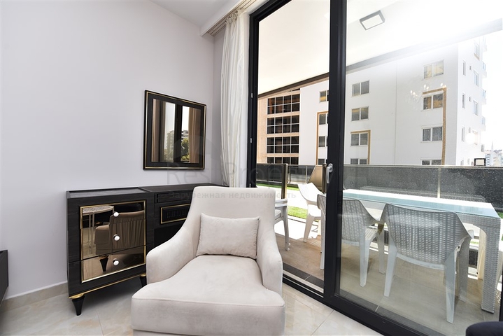 شقة بتصميم غرفتين وصالة  - ضمن مجمع حديث في مهموتلار 