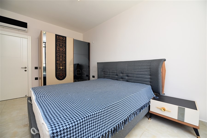 شقة بتصميم غرفتين وصالة  - ضمن مجمع حديث في مهموتلار 