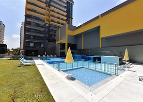 شقة بتصميم غرفتين وصالة  - ضمن مجمع حديث في مهموتلار 