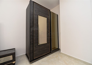 شقة بتصميم غرفتين وصالة  - ضمن مجمع حديث في مهموتلار 