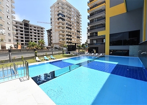 شقة بتصميم غرفتين وصالة  - ضمن مجمع حديث في مهموتلار 