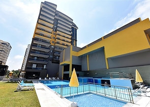 شقة بتصميم غرفتين وصالة  - ضمن مجمع حديث في مهموتلار 