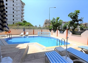 غرفة نوم وصالة مؤثثة في منطقة مركزية في اوبا 