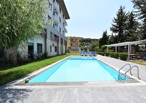 فرصة ذهبية - شقة عائلية ضمن مجمع حديث في منطقة اوبا 