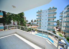 اول صف على البحر - شقة مؤثثة من تصميم غرفتين وصالة في مهموتلار / الانيا 