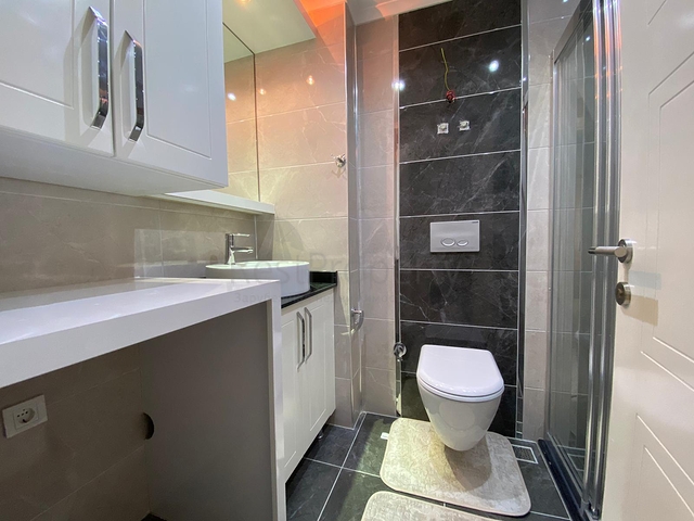 شقة تصميم غرفة وصالة ضمن مجمع سكني حديث في مهموتلار 