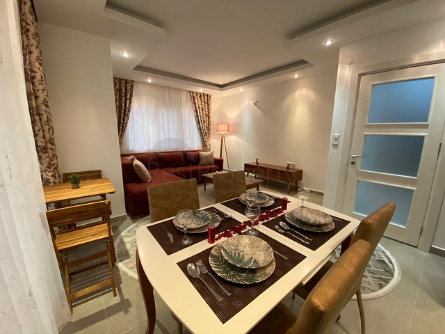 شقة تصميم غرفة وصالة ضمن مجمع سكني حديث في مهموتلار 