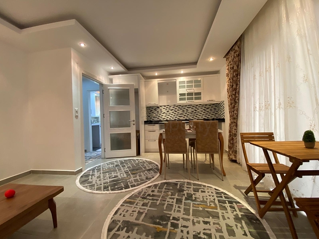 شقة تصميم غرفة وصالة ضمن مجمع سكني حديث في مهموتلار 