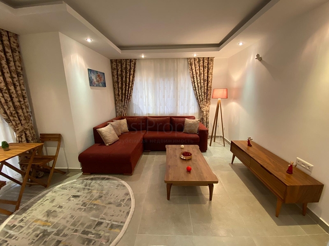 شقة تصميم غرفة وصالة ضمن مجمع سكني حديث في مهموتلار 