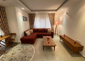 شقة تصميم غرفة وصالة ضمن مجمع سكني حديث في مهموتلار 