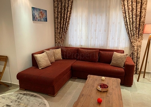 شقة تصميم غرفة وصالة ضمن مجمع سكني حديث في مهموتلار 