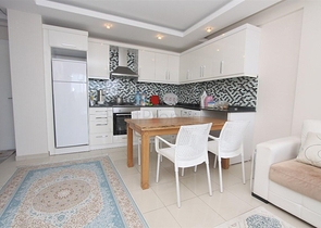 شقة غرفة وصالة مفروشة ضمن مجمع سكني في منطقة توسمور / الانيا 