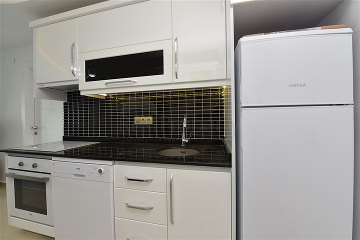 شقة مؤثثة من تصميم غرفة وصالة ضمن مجمع سكني فاخر في مهموتلار / الانيا 