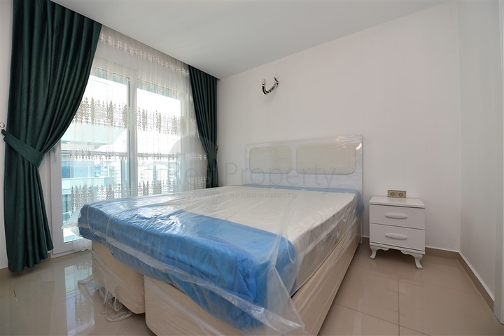 شقة مؤثثة من تصميم غرفة وصالة ضمن مجمع سكني فاخر في مهموتلار / الانيا 