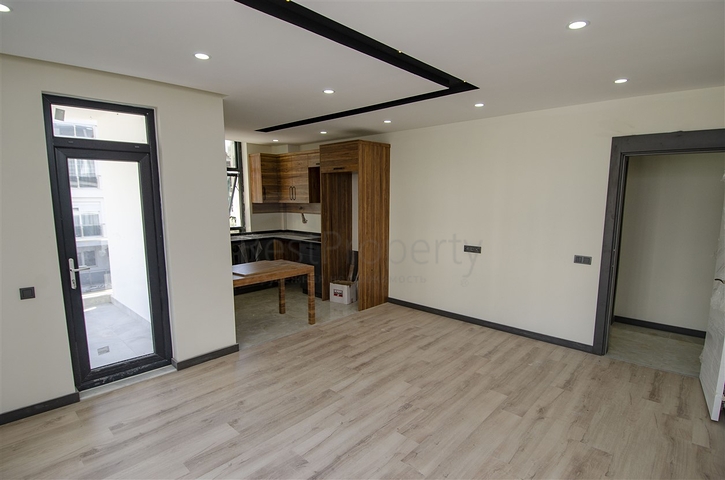 شقق 1 + 1 و 2 + 1 في منزل جديد في هورم كونيالتي أنطاليا