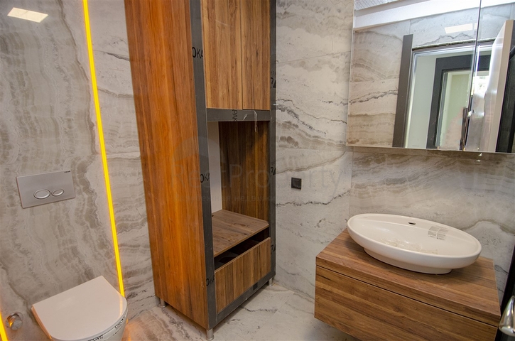 شقق 1 + 1 و 2 + 1 في منزل جديد في هورم كونيالتي أنطاليا