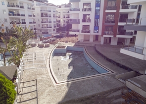 شقق 1 + 1 و 2 + 1 في منزل جديد في هورم كونيالتي أنطاليا