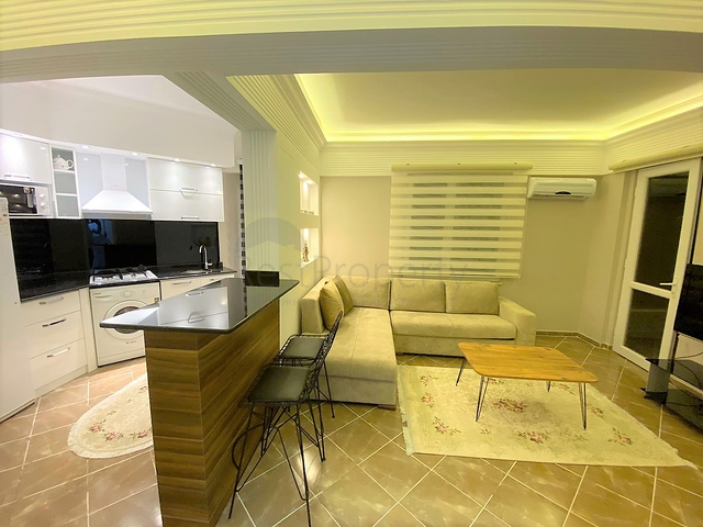 شقة غرفة وصالة - اكساء واثاث جديد - في منطقة حيوية - اوبا / الانيا 