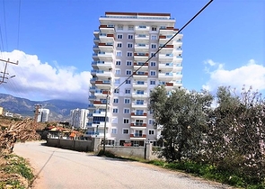 شقة 2 غرفة وصالة  - ضمن مجمع يضم كافة الخدمات - مهموتلار / الانيا 