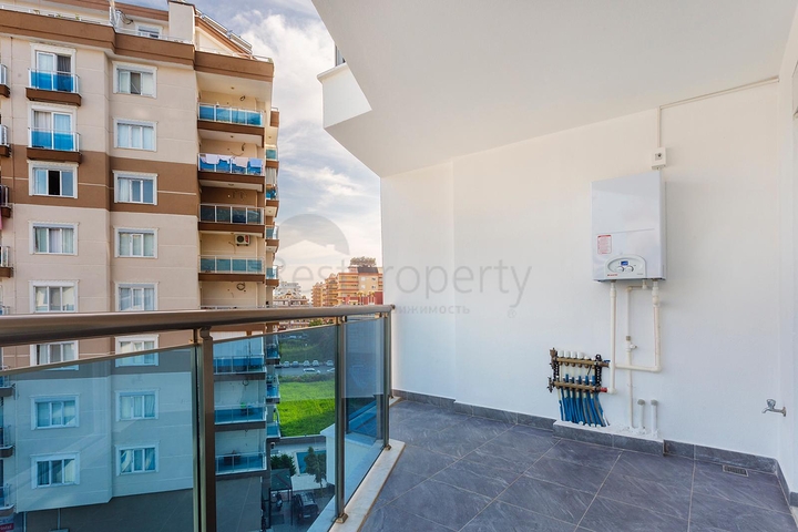 شقة غرفتين وصالة - ضمن مجمع يضم كافة الخدمات - مهموتلار/ الانيا  