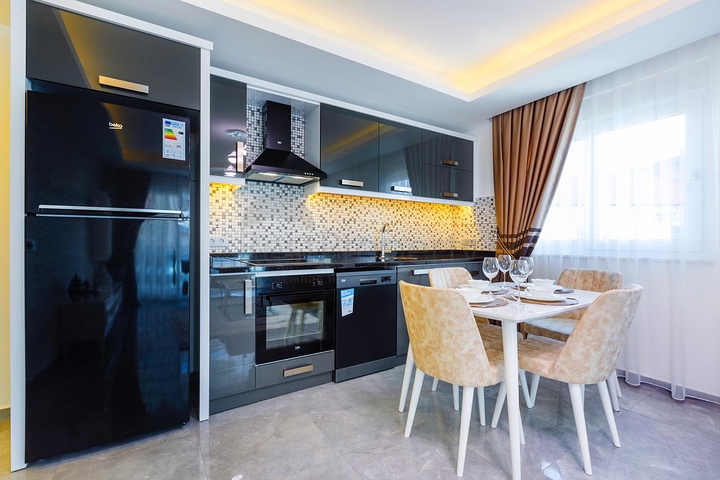 شقة غرفتين وصالة - ضمن مجمع يضم كافة الخدمات - مهموتلار/ الانيا  