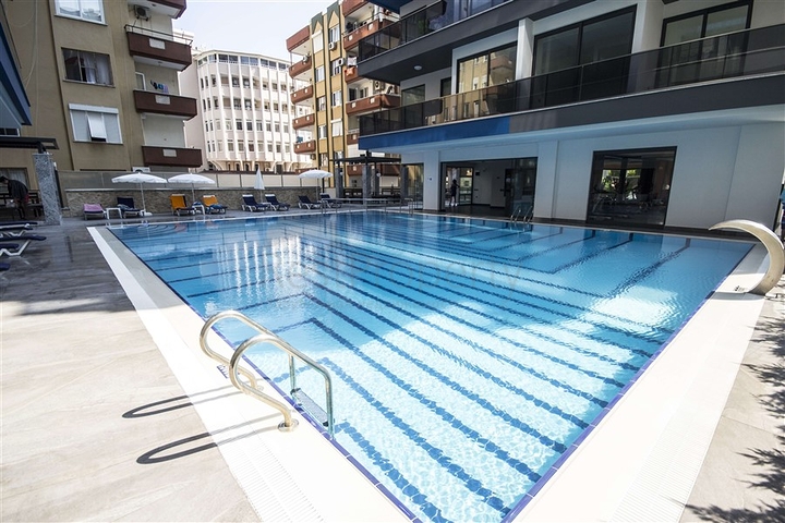 اول صف على البحر - شقة 2 غرفة وصالة - مجمع حديث -مهموتلار / الانيا 