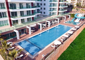 مجمع بخدمات ممتازة - شقة غرفة وصالة مفروشة - في منطقة توسمور/ الانيا 