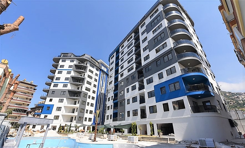 شقة غرفتين وصالة - ضمن مجمع حديث - في مركز الانيا 