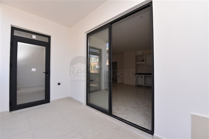 شقة غرفتين وصالة - ضمن مجمع حديث - في مركز الانيا 