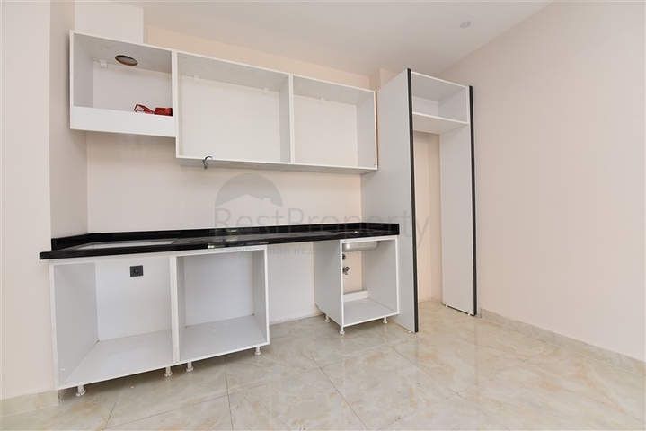 شقة غرفتين وصالة - ضمن مجمع حديث - في مركز الانيا 