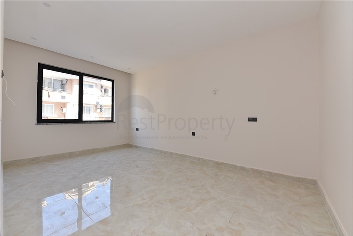 شقة غرفتين وصالة - ضمن مجمع حديث - في مركز الانيا 