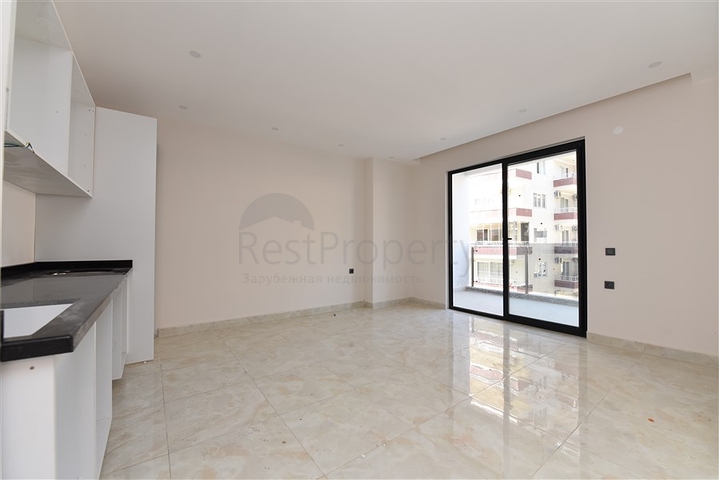 شقة غرفتين وصالة - ضمن مجمع حديث - في مركز الانيا 