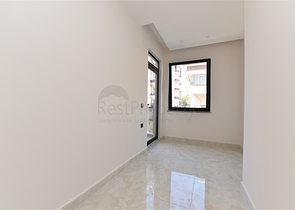 شقة غرفتين وصالة - ضمن مجمع حديث - في مركز الانيا 