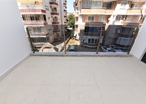 شقة غرفتين وصالة - ضمن مجمع حديث - في مركز الانيا 