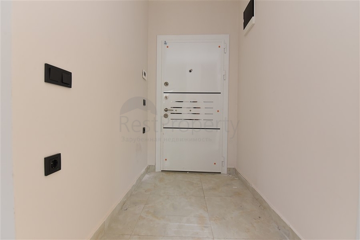 ضمن مجمع سكني حديث -شقة غرفتين وصالة -في مركز مدينة الانيا 