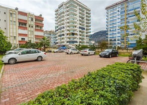 شقة واسعة مع مطبخ منفصل -تصميم 2 غرفة وصالة - ضمن مجمع فاخر - مهموتلار / الانيا 