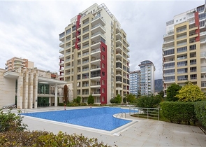 شقة واسعة مع مطبخ منفصل -تصميم 2 غرفة وصالة - ضمن مجمع فاخر - مهموتلار / الانيا 