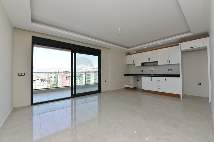 اطلالة بحر مباشرة - شقة طابق مرتفع -غرفتين وصالة -مجمع حديث /مهموتلار / الانيا 