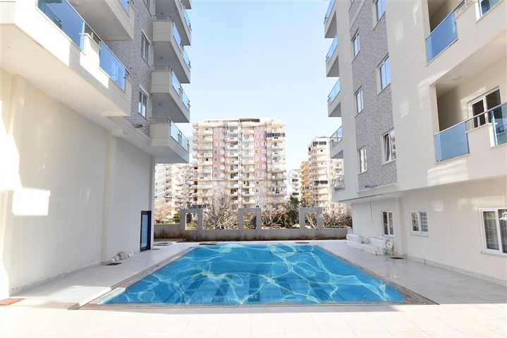 شقة مفروشة ضمن مجمع سكني حديث - تصميم 1+1 - في مهموتلار / الانيا 