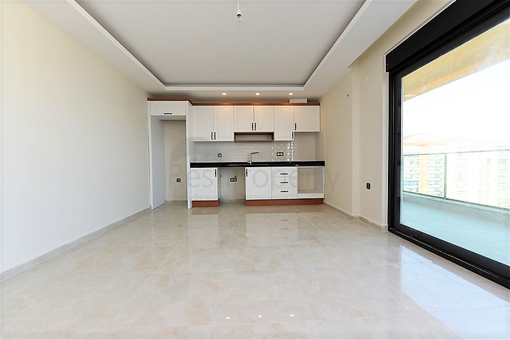 اول صف على البحر - شقة غرفتين وصالة طابق مرتفع -- مهموتلار / الانيا 