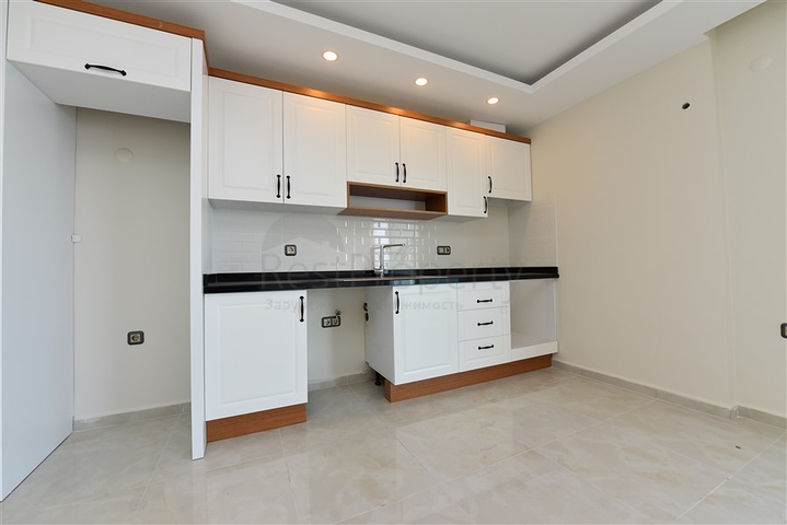 اول صف على البحر - شقة غرفتين وصالة طابق مرتفع -- مهموتلار / الانيا 