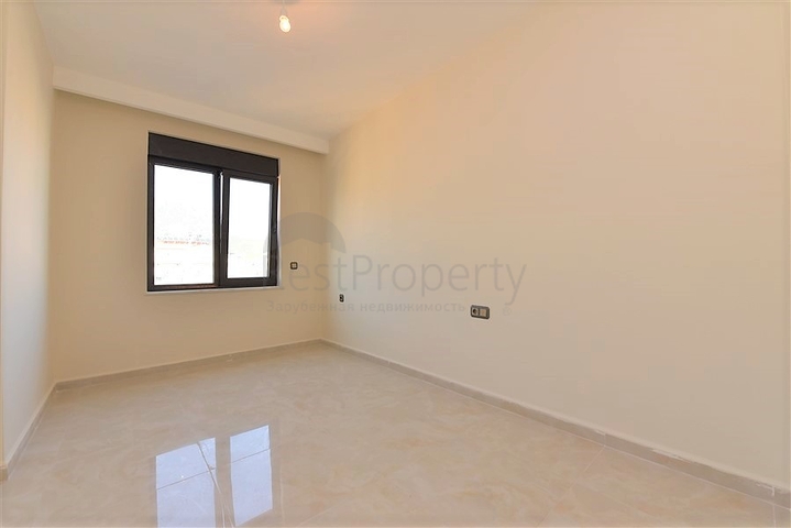 اول صف على البحر - شقة غرفتين وصالة طابق مرتفع -- مهموتلار / الانيا 