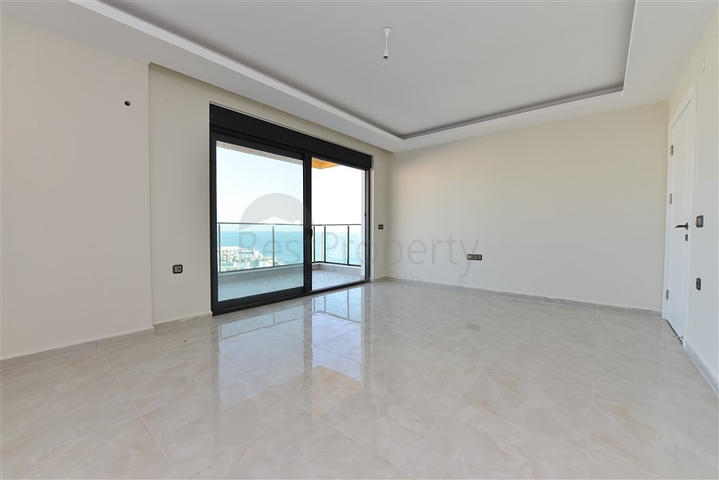 اول صف على البحر - شقة غرفتين وصالة طابق مرتفع -- مهموتلار / الانيا 