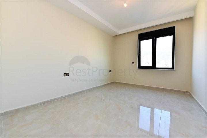 اول صف على البحر - شقة غرفتين وصالة طابق مرتفع -- مهموتلار / الانيا 