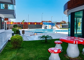 اول صف على البحر - شقة غرفتين وصالة طابق مرتفع -- مهموتلار / الانيا 