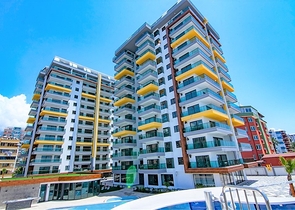 اول صف على البحر - شقة غرفتين وصالة طابق مرتفع -- مهموتلار / الانيا 