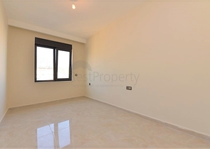 اول صف على البحر - شقة غرفتين وصالة طابق مرتفع -- مهموتلار / الانيا 